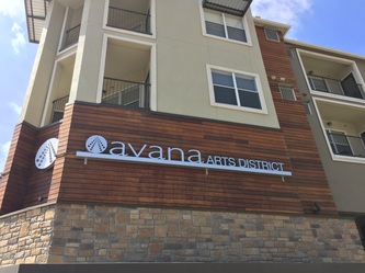 Hardwood siding accents on a multistory residential building